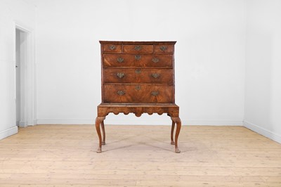 Lot 413 - A walnut chest-on-stand