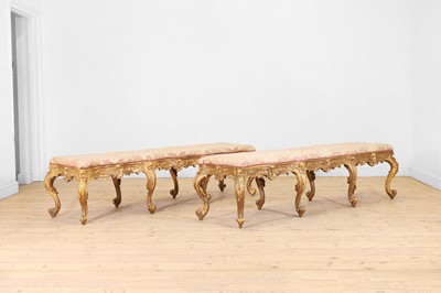 Lot 18 - A pair of carved giltwood and gesso stools or hall seats