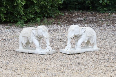Lot 623 - A pair of white marble elephants