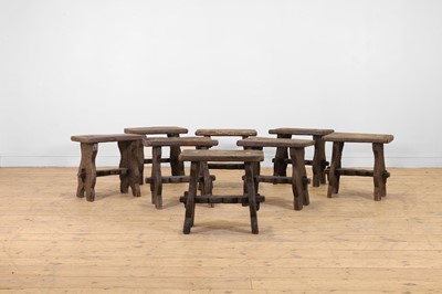 Lot 48 - A set of eight rustic oak stools
