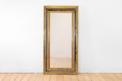 Lot 98 - A brass-clad and verre églomisé pier mirror