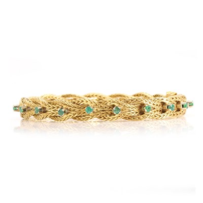 Lot 122 - An 18ct gold emerald set bracelet, c.1960s