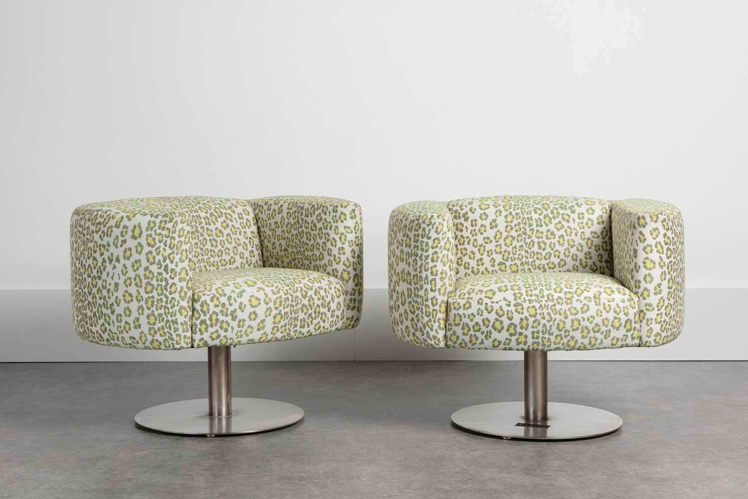 Lot 337 - A pair of revolving armchairs