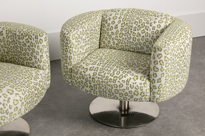 Lot 337 - A pair of revolving armchairs