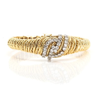 Lot 120 - A ladies' 18ct gold diamond bracelet watch with concealed dial, by Chaumet