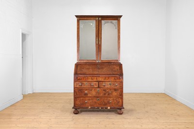 Lot 208 - A William and Mary figured walnut and feather-banded bureau bookcase