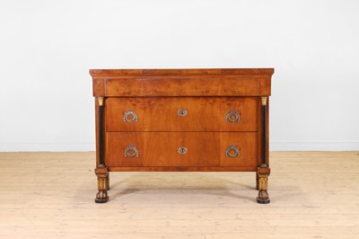 Lot 16 - An Empire walnut, ebonised and parcel-gilt commode