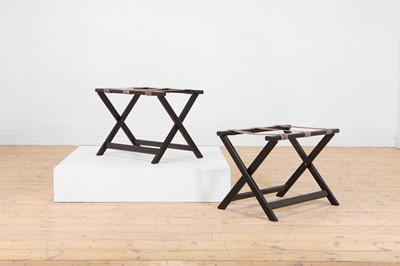 Lot 268 - A pair of ebonised wooden luggage stands