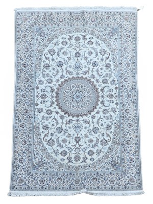 Lot 503 - A signed Nain wool rug