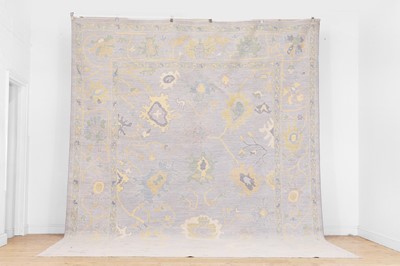 Lot 51 - A large Oushak wool carpet