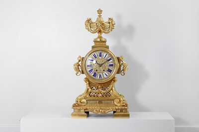 Lot 204 - A Louis XIV-style gilt-bronze mantel clock