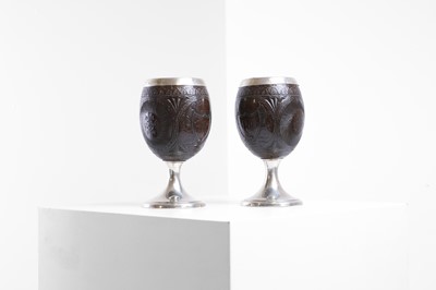 Lot 37 - A pair of George III silver-mounted coconut cups
