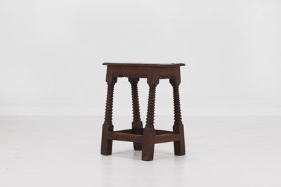 Lot 39 - A carved oak joint stool