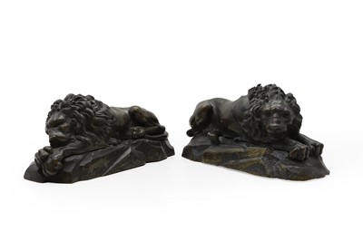 Lot 166 - A pair of recumbent bronze lions