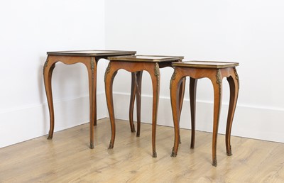 Lot 463 - A nest of three Louis XV style parquetry tables