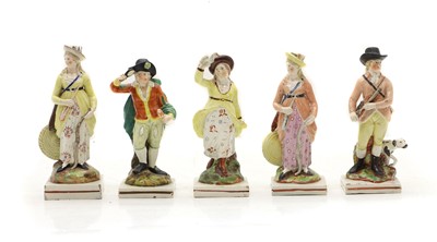 Lot 98 - A group of five Staffordshire pottery figures