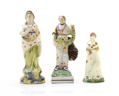Lot 96 - A group of three Staffordshire pottery figures