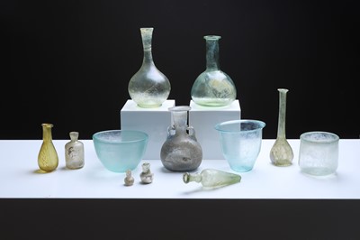 Lot 372 - A collection of Roman glass vessels