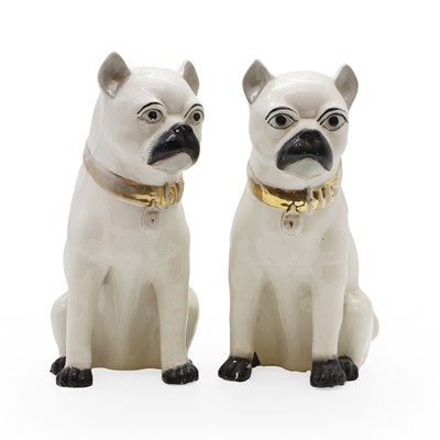 Lot 100 - A pair of Staffordshire pottery pug dogs