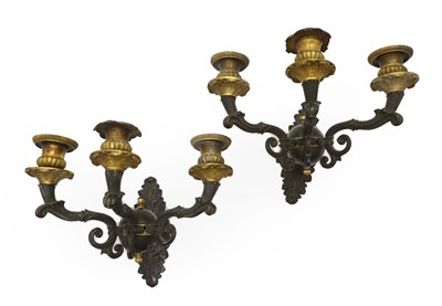 Lot 312 - A pair of Regency patinated and gilt bronze three branch wall appliques