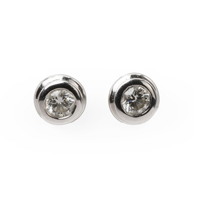 Lot 1045 - A pair of white gold diamond stud earrings