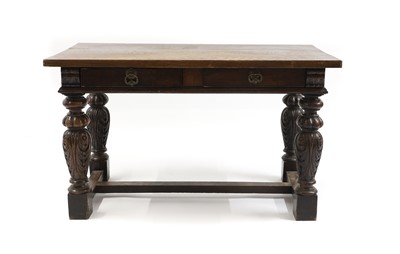 Lot 514 - A carved oak table