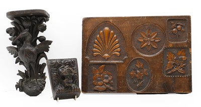 Lot 203 - A group of three carved oak panels