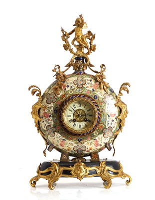 Lot 256 - A gilt metal mounted pottery mantel clock