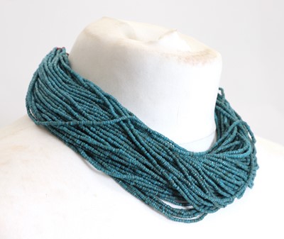 Lot 112 - A Naga blue glass multi-strand beaded necklace