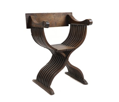 Lot 502 - A Northern European fruitwood X frame chair
