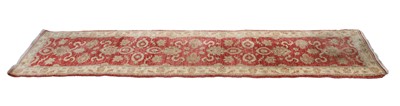 Lot 386 - A hand knotted Agra red ground runner