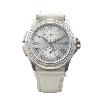 Lot 287 - An 18ct white gold diamond set Patek Philippe Travel Time Calatrava mechanical strap watch