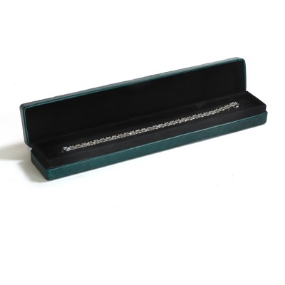 Lot 231 - A platinum and diamond line bracelet
