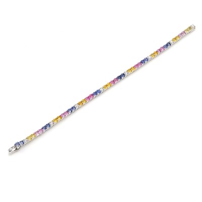 Lot 239 - A vari-coloured sapphire and diamond tennis bracelet, by Chatila