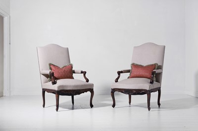 Lot 330 - A pair of Louis XV provincial walnut and beech fauteuils
