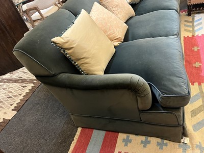 Lot 333 - A three-seater sofa in the style of Howard & Sons