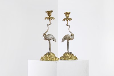 Lot 59 - A pair of ormolu and silvered candlesticks
