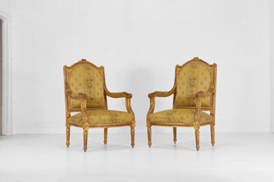 Lot 522 - A pair of Louis XVI-style carved giltwood fauteuils