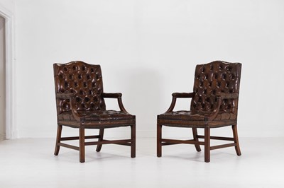 Lot 263 - A pair of George III-style mahogany and buttoned-leather Gainsborough library armchairs