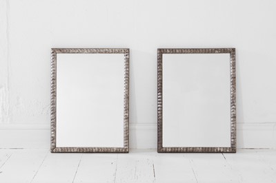 Lot 138 - A pair of silvered wooden mirrors