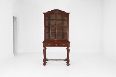 Lot 517 - A mahogany cabinet-on-stand in the Queen Anne taste
