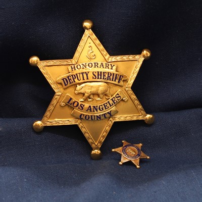 Lot 61 - An Honorary Deputy Sheriff Los Angeles County gilt-metal badge