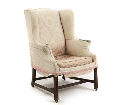 Lot 518 - A George III mahogany wing armchair