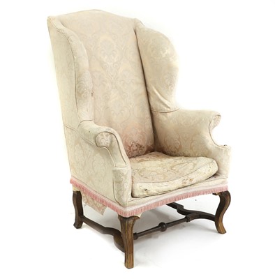 Lot 519 - A George I walnut wingback armchair