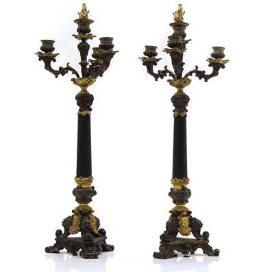 Lot 302 - A pair of paternated gilt and bronze Regency style candlabra