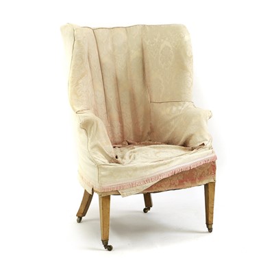 Lot 431 - A barrel back armchair