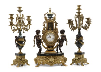 Lot 207 - A Neoclassical style gilt metal mantle clock and garniture