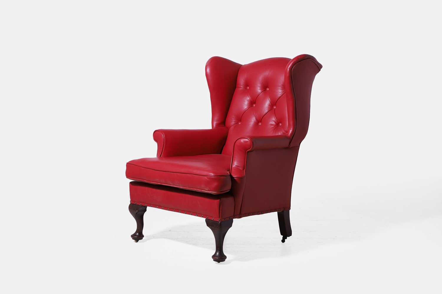 Lot 521 - A Queen Anne-style mahogany wing armchair