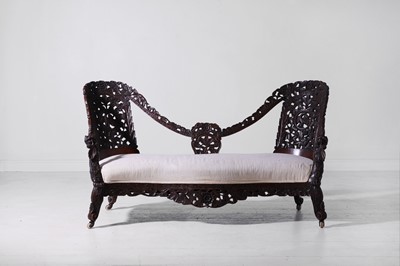 Lot 179 - A carved teak settee