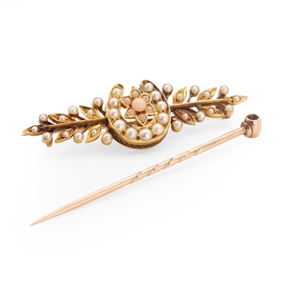 Lot 1011 - A Victorian split pearl and coral set horseshoe brooch and a stick pin